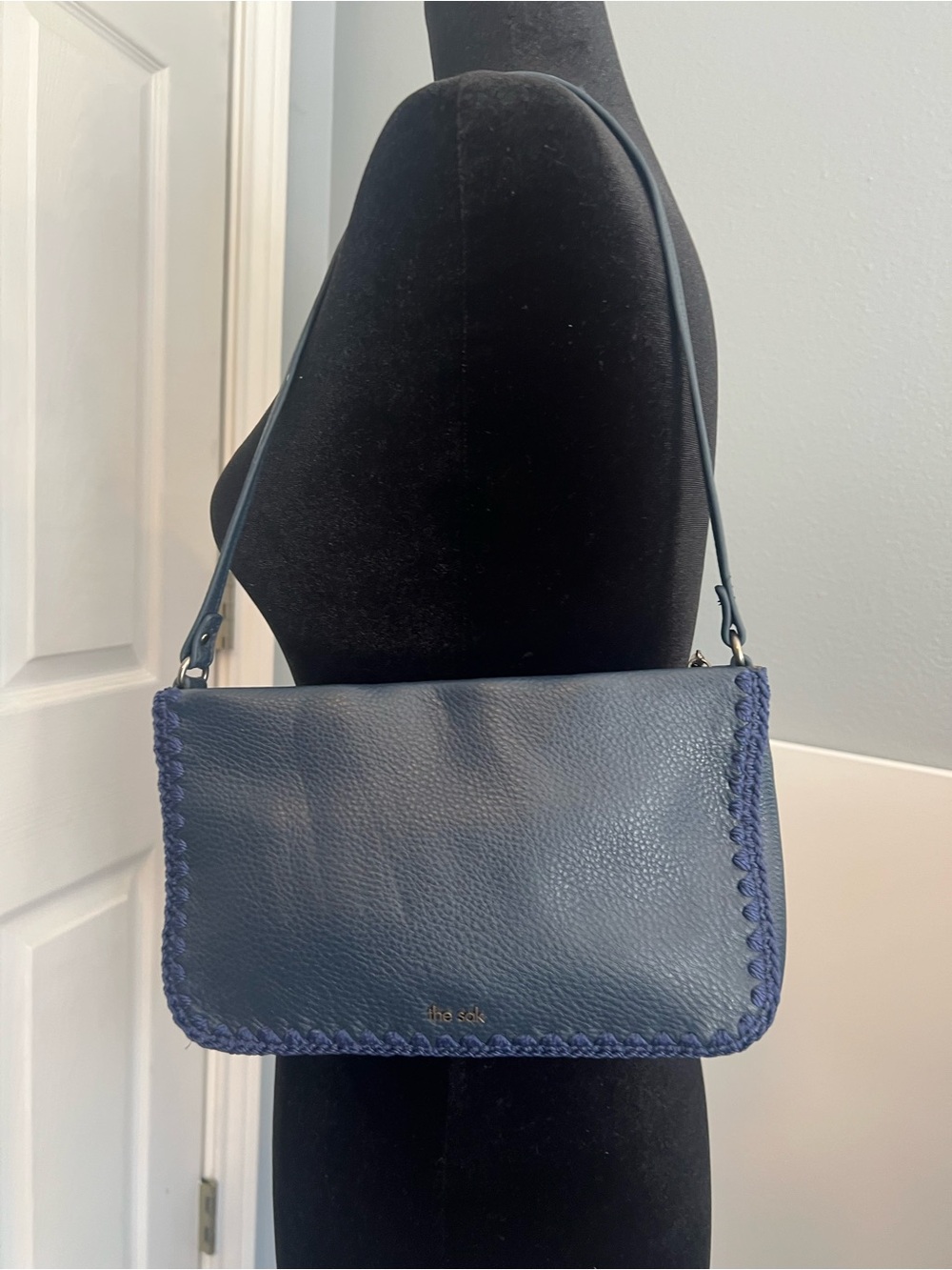 The Sak “Flora” Navy Leather Shoulder Bag with Braided Trim